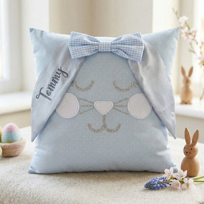 Light blue bunny cushion with a gingham bow and the name Tommy embroidered on one ear