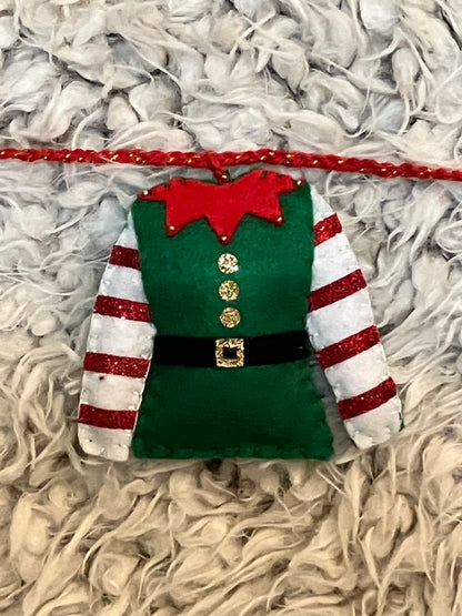 A closeup of a single green elf outfit with red and white striped sleeves.