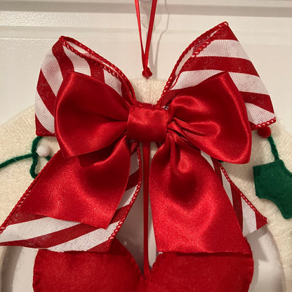 Red and white striped bow with a solid red bow on top.